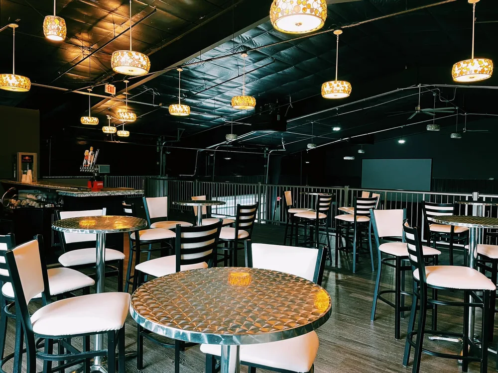 Reserved high-top tables and seating overlooking the main floor